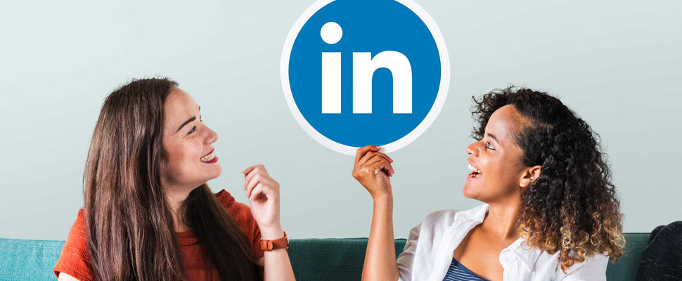 Woman holding emoticons on a couch