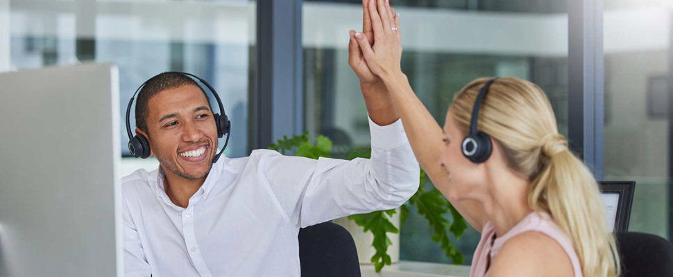 High five, call center and teamwork with people in office for de