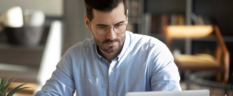 Focuses man calculate expenses pay bills online