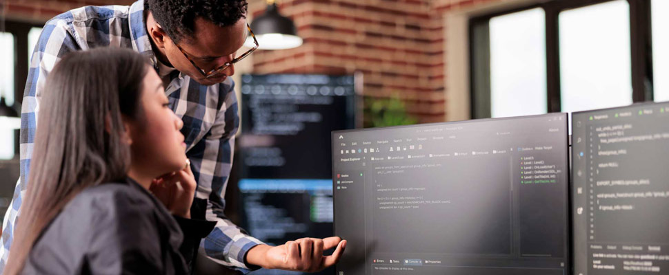 Diverse programmers discussing about html code Diverse programmers discussing about html code
