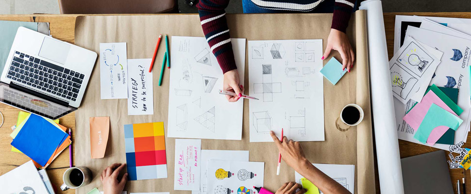 Colleagues working together at a desk Colleagues working together at a desk