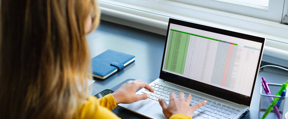 Focused caucasian woman sitting at desk, working from home and using laptop in sunny room. Lifestyle, communication, remote working, technology and domestic life, unaltered. Focused caucasian woman sitting at desk, working from home and using laptop in sunny room. Lifestyle, communication, remote working, technology and domestic life, unaltered.