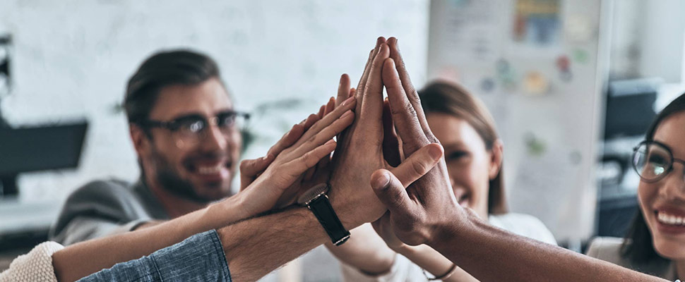 High-five! Top view of business colleagues giving each other hig