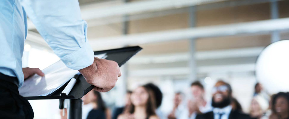 Closeup, business and man with a crowd, presentation and confere
