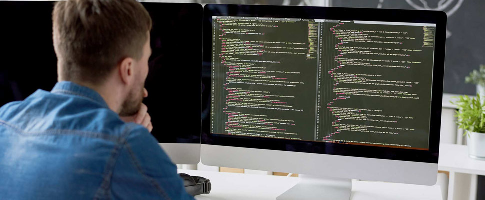 Introspective programmer examining code Introspective programmer examining code