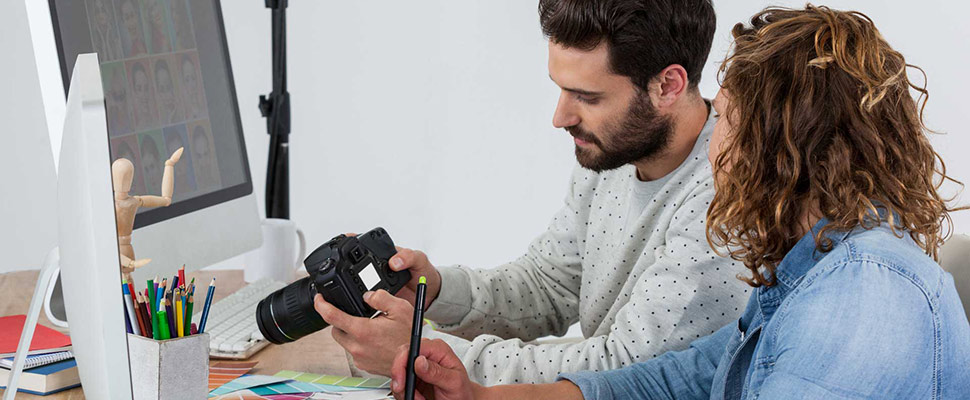 Photographers working together at the desk